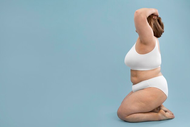 Free Photo Confident Oversized Woman Posing In White Lingerie