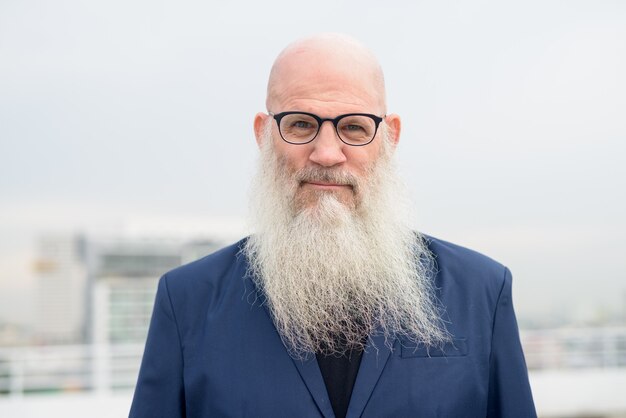 Premium Photo Face Of Mature Bald Bearded Businessman With Eyeglasses