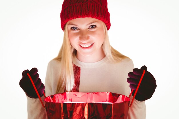 Premium Photo Festive Blonde Opening A Gift Bag