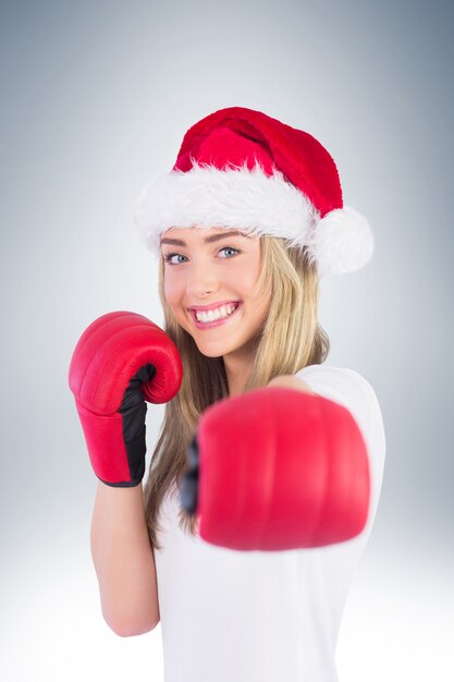 Premium Photo Festive Blonde Punching With Boxing Gloves