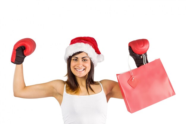 Premium Photo Festive Brunette In Boxing Gloves Holding Shopping Bags