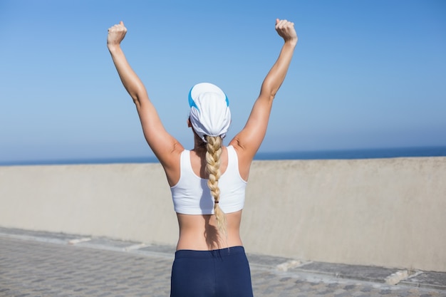 Premium Photo Fit Blonde Cheering On The Pier