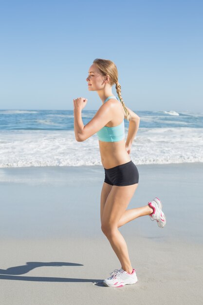 Premium Photo Fit Blonde Jogging On The Beach