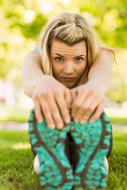 Premium Photo Fit Blonde Stretching On The Grass