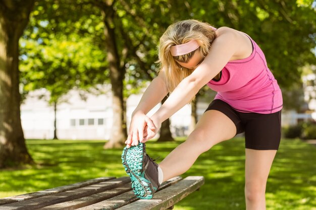 Premium Photo Fit Blonde Stretching Her Leg