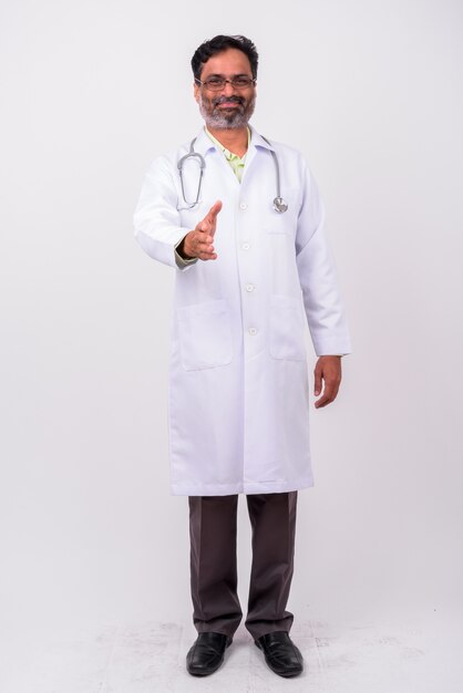 Premium Photo Mature Handsome Bearded Indian Man Doctor On White