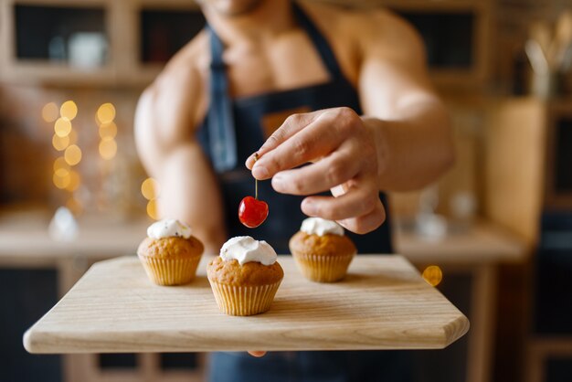 Premium Photo Naked Man In Apron Cooking Dessert On The Kitchen