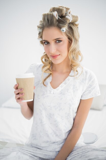 Premium Photo Peaceful Pretty Blonde Wearing Hair Curlers Holding Coffee