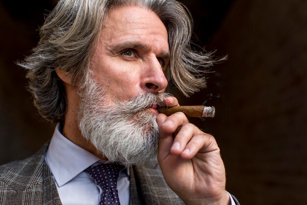 Premium Photo Portrait Of Bearded Mature Male Smoking