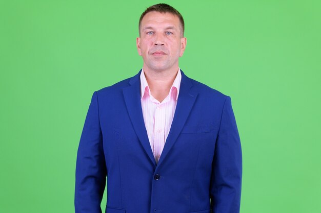 Premium Photo Portrait Of Mature Macho Businessman Wearing Blue Suit