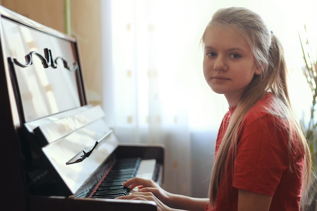 Teen Girl Playing Piano