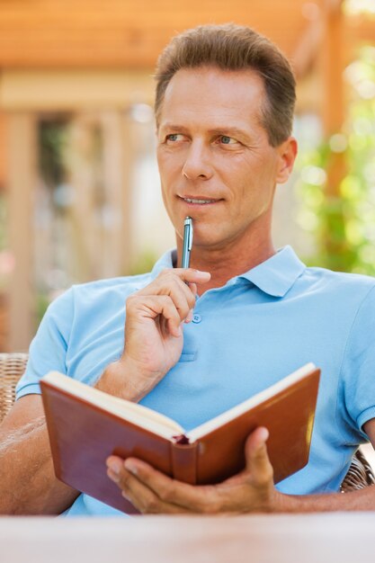 Premium Photo Waiting For Inspiration Thoughtful Mature Man Holding