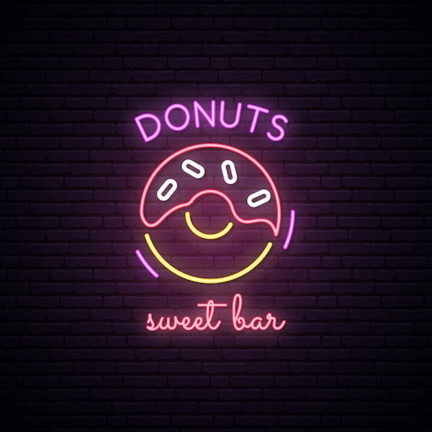 Neonowy znak słodcy donuts. Premium Wektorów