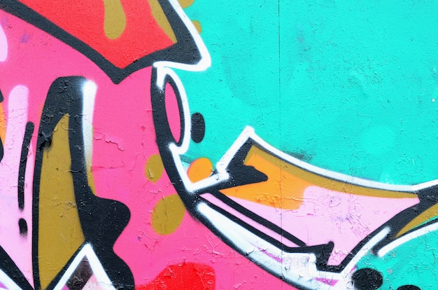 Fragment pięknego wzoru graffiti w kolorze różowym i zielonym z czarnym konturem. tło sztuki ulicznej Premium Zdjęcia
