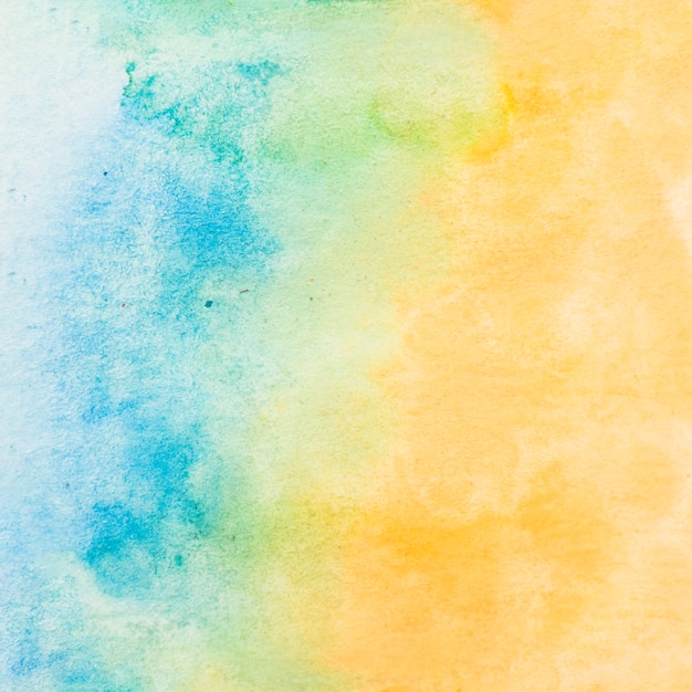 Malujący textured papier z błękitnym i żółtym wodnego koloru tłem Darmowe Zdjęcia