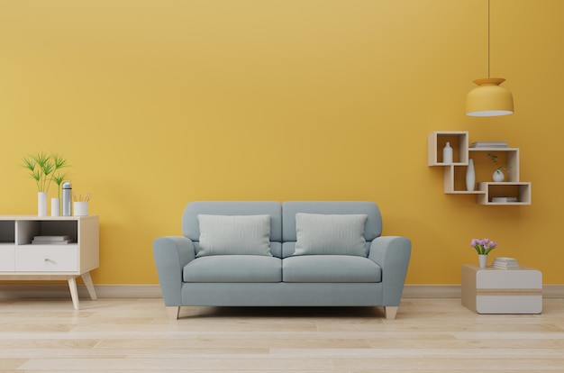 Wnętrze nowoczesnego salonu z sofą i zielonych roślin, lampa, stół na ścianie żółty. Premium Zdjęcia