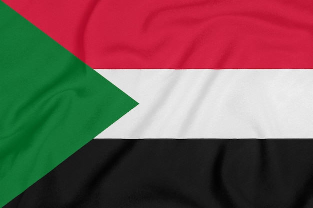 Bandera De Sudán Sobre Tela Con Textura Símbolo Patriótico Foto Premium