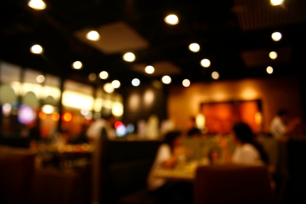 Cliente en restaurante desenfoque de fondo con bokeh | Foto Premium