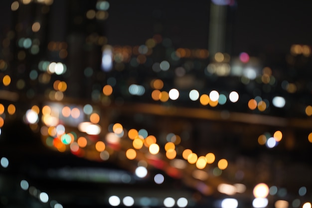 Luz Defocused De La Noche De La Ciudad Borrosa Con El Fondo Abstracto