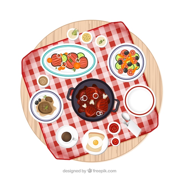 Mesa de picnic con la variedad de platos de comida