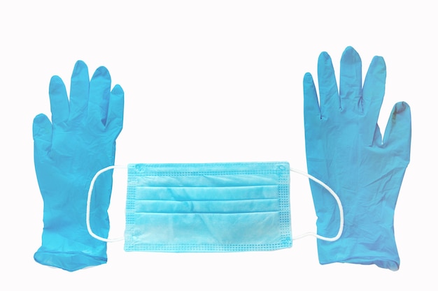 Un par de guantes de látex médicos azules y una máscara protectora