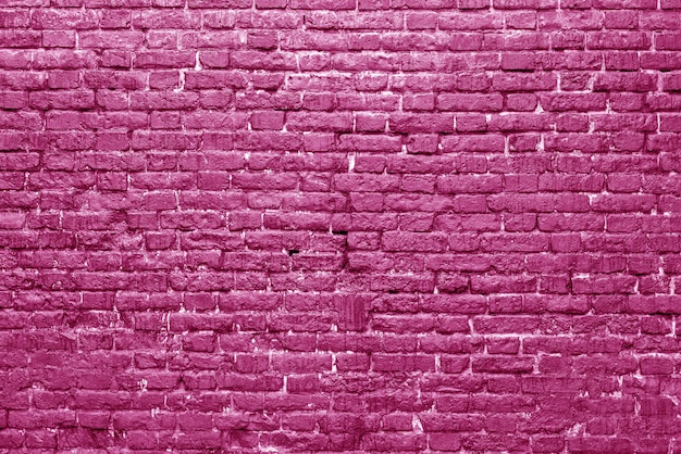 Pared de ladrillo rosa loft de diseño de interiores. pintura rosada de la fachada. fondo