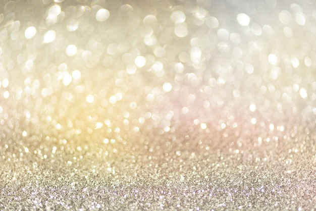 Luci astratte del bokeh dell'oro e dell'argento. priorità bassa lucida di scintillio con lo spazio della copia. Foto Premium