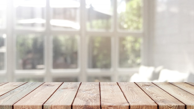 Piano d'appoggio di legno vuoto e caffè vago del bokeh e fondo interno del restaurent con il filtro d'annata Foto Premium