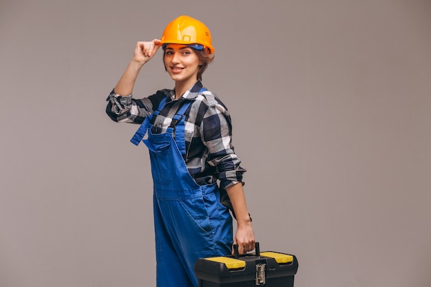 Riparatore di donna in uniforme con cassetta degli attrezzi Foto Gratuite