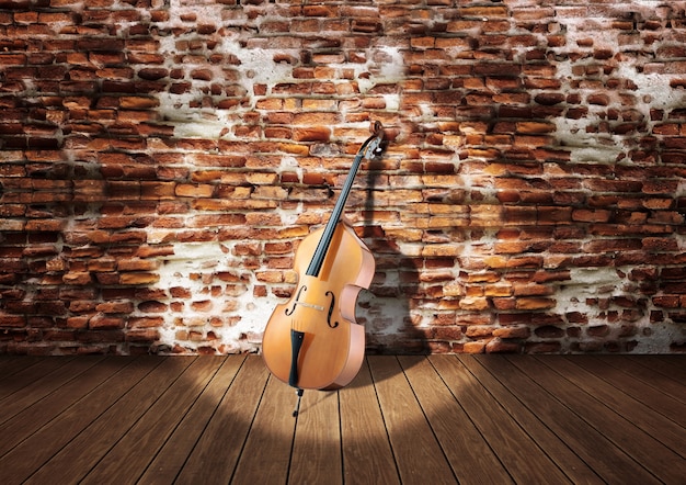 Violoncello sul palco appoggiato al muro di mattoni rustici Foto Premium