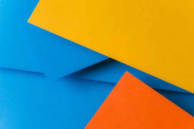 Azul; papéis de cor laranja e amarelo para o fundo Foto