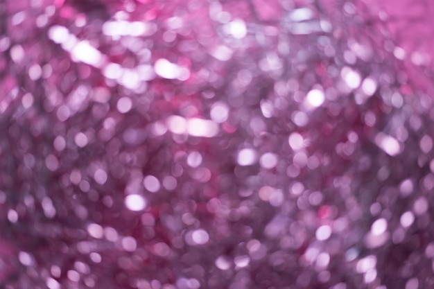 Borrão de enfeites de natal. resumo borrado de fundo rosa e prata luzes Foto Premium