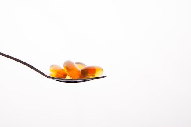 Cápsula de vitamina óleo de peixe para o conceito saudável Foto Premium