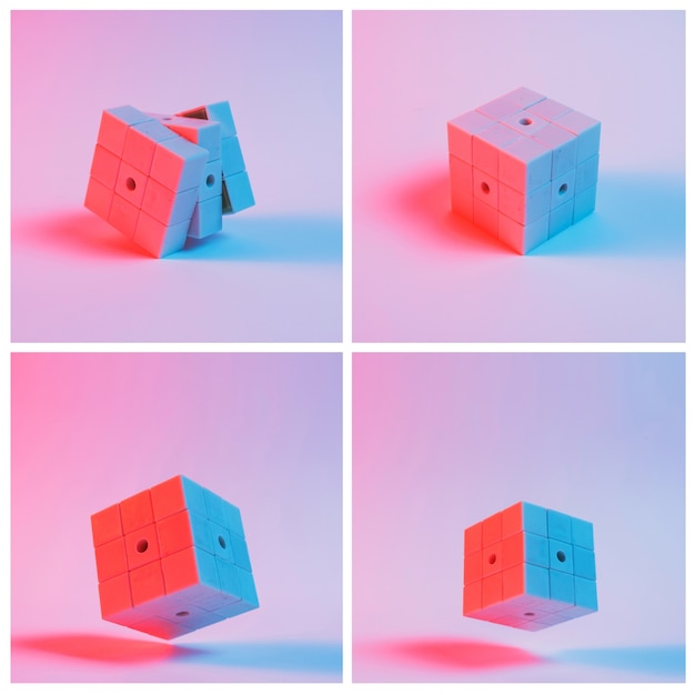 Close-up, de, cubos quebra-cabeça, contra, fundo cor-de-rosa, com, sombra Foto gratuita