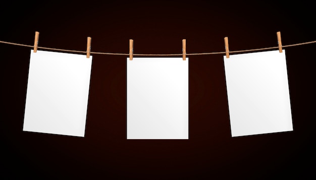Folha de papel vazia pendurado na corda Foto Premium