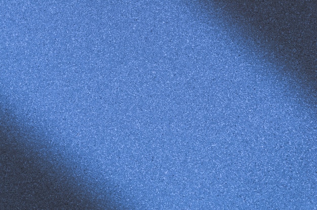 Fundo de granito com cor azul com pequenos pontos. escurecimento à esquerda e à direita na diagonal. Foto Premium