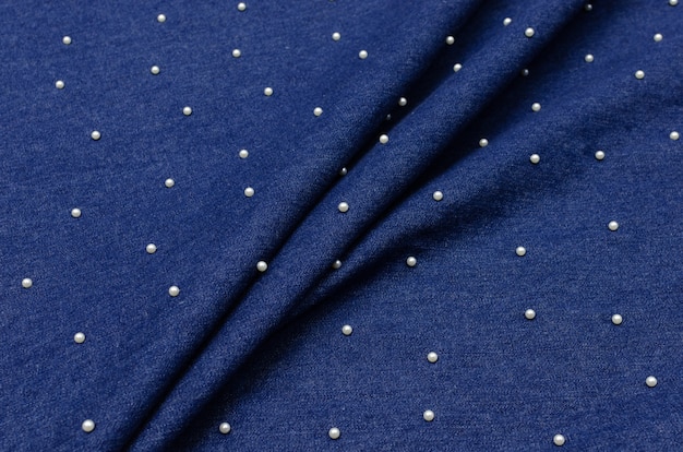 Jeans de tecido de algodão azul com pérolas Foto Premium