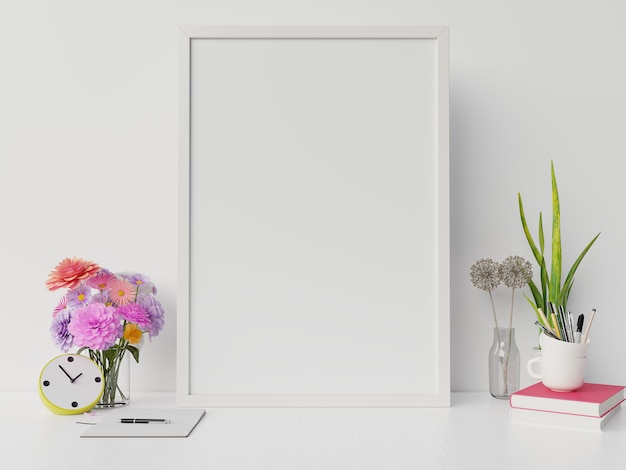 Maquete do cartaz com moldura vertical e direita / esquerda tem livro, flor fundo de parede branca, renderização em 3d Foto Premium