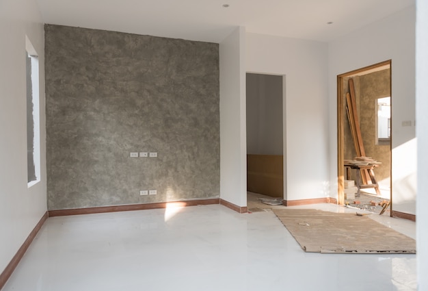 Quarto renovado com piso e parede de cimento-loft Foto Premium