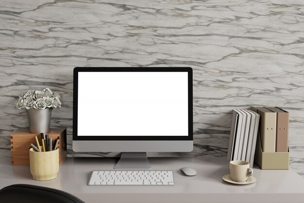 Zombe do espaço de trabalho com a tela branca do computador de mesa e a parede de mármore. Foto Premium