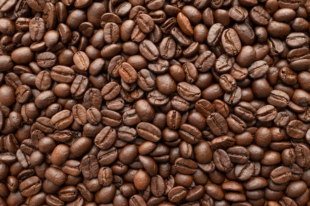 Gebraten von kaffeebohnen für hintergrund. nahansicht. Premium Fotos