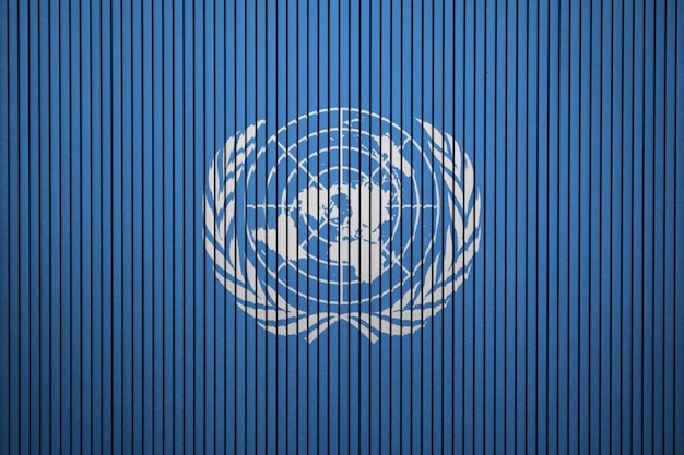 Gemalte flagge der vereinten nationen auf einer betonmauer Premium Fotos