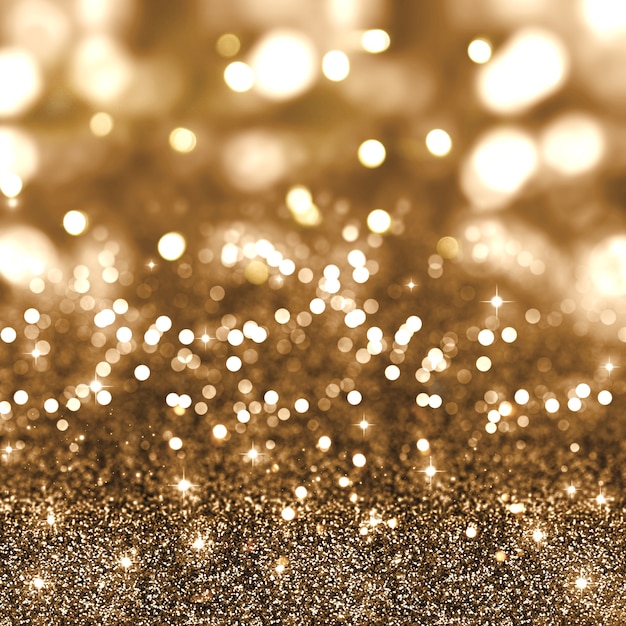 Gold christmas glitter hintergrund mit sternen und bokeh lichter