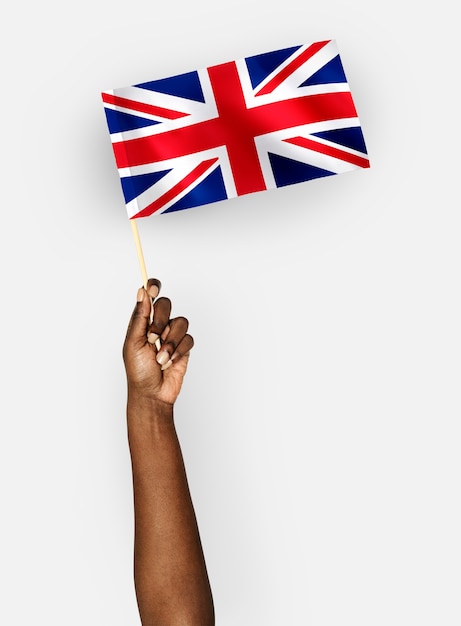 Person Weht Die Flagge Des Vereinigten Konigreichs Von Grossbritannien Und Nordirland Kostenlose Foto