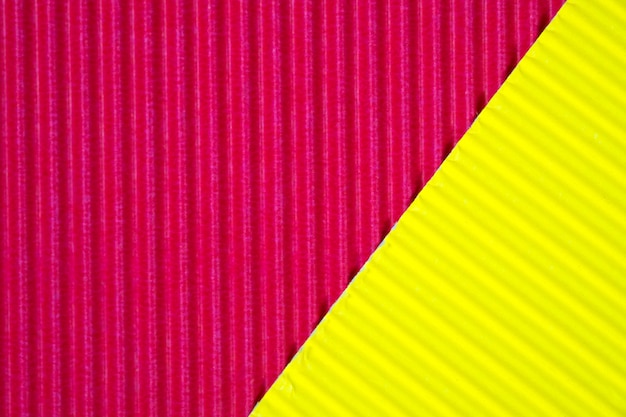 Roter und gelber wellpappebeschaffenheitshintergrund. Premium Fotos