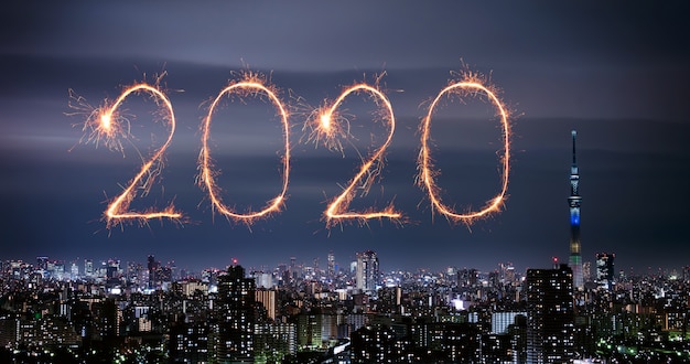 Premium Photo | 2020 happy new year fireworks over tokyo cityscape at night, japan