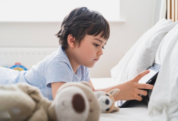 7 year old boy playing with stuffed animals