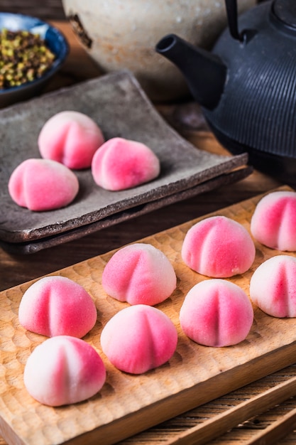 A peach-shaped birthday bun known as the Longevity Peach.Chinese ...