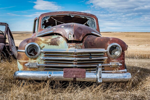 Premium Photo | Abandoned vintage green car on the prairies in saskatchewan