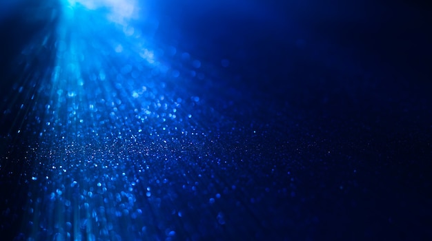 Premium Photo | Abstract background of blue glitter lights defocused ...